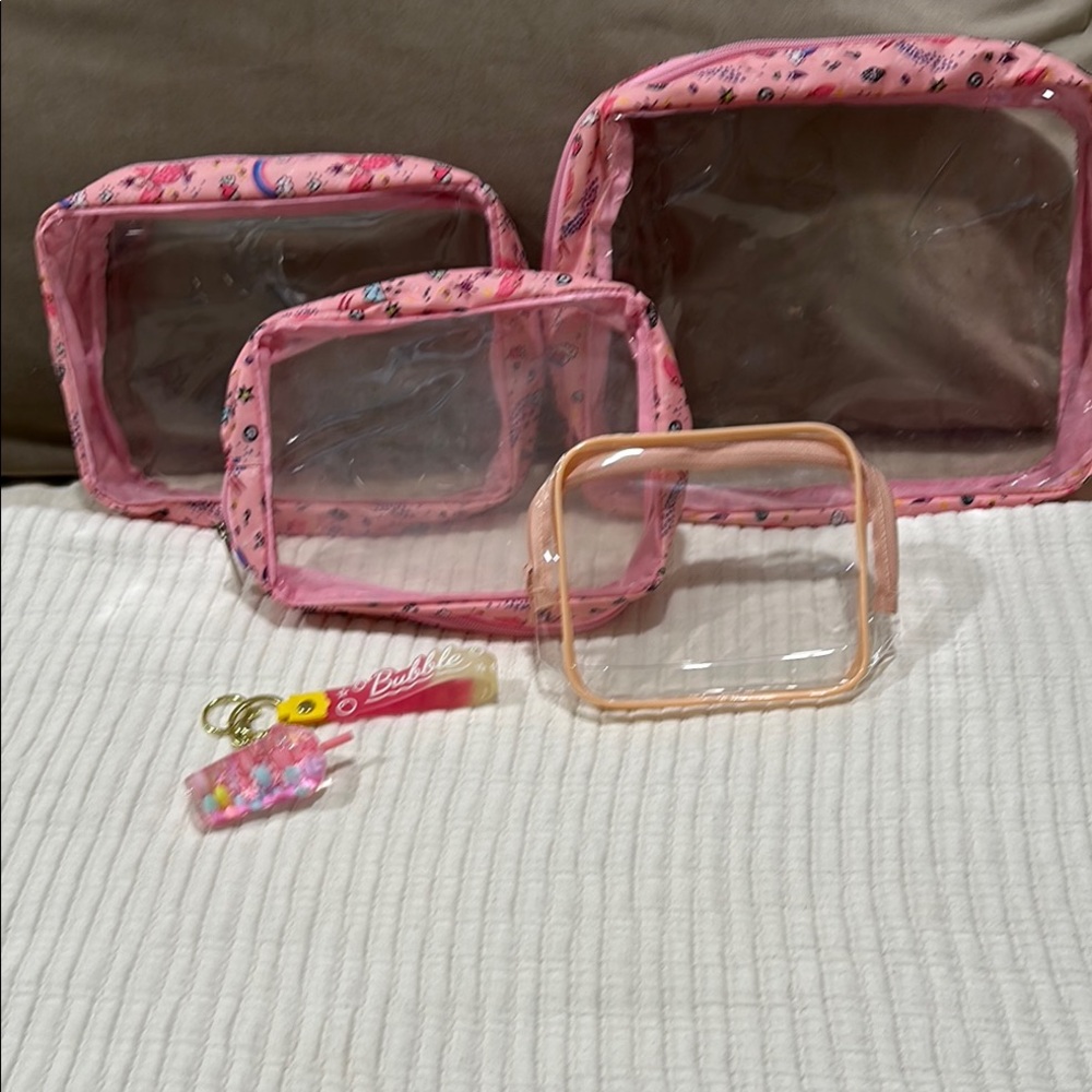 Four clear storage bags and a keychain